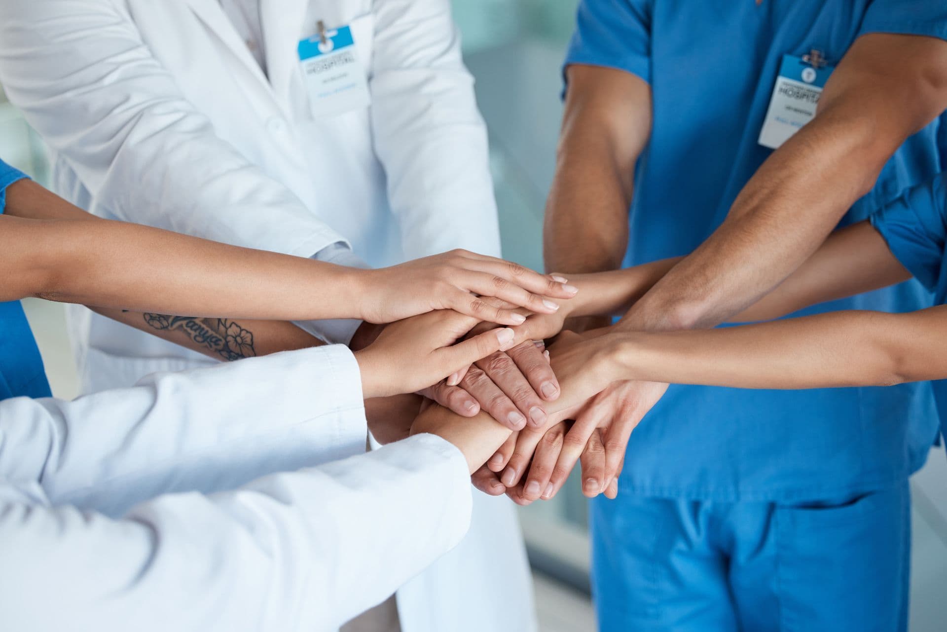Ashworths Clinic team hands together